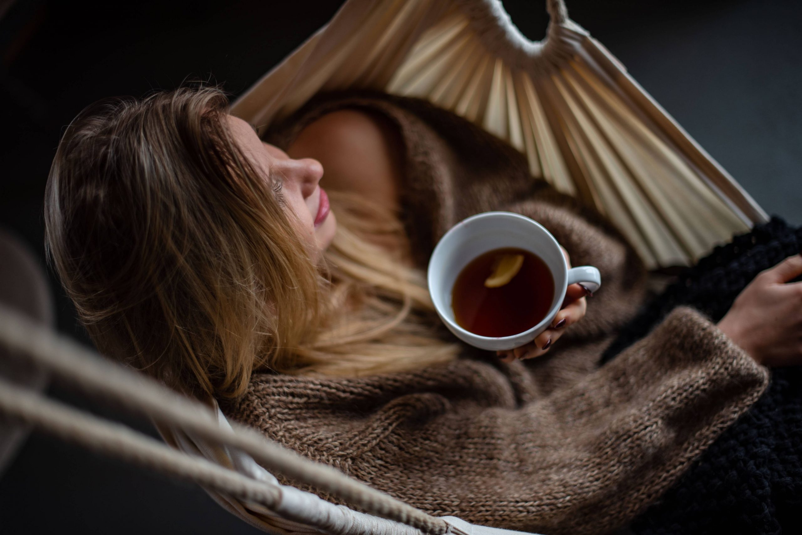 Girl drinking tea on a hammock - Darren Yaw Wife