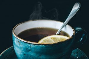 tea in a cup with a slice of lemon - darren yaw wife website