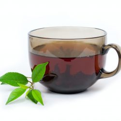 Tea cup with green leaves
